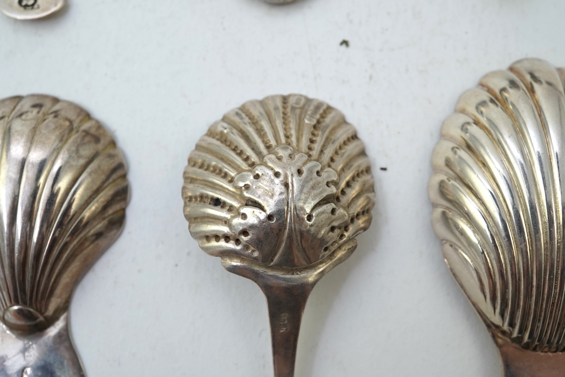 Ten assorted 19th and 20th century silver caddy spoons, with shell or fluted bowls